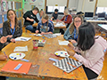  teachers working with students during a collegial circle project